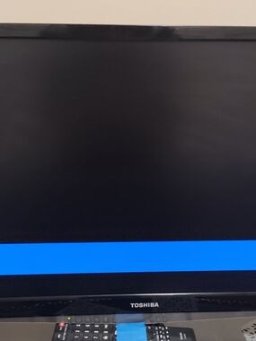 Toshiba Flat Screen TV in Black with Blue Display Accent